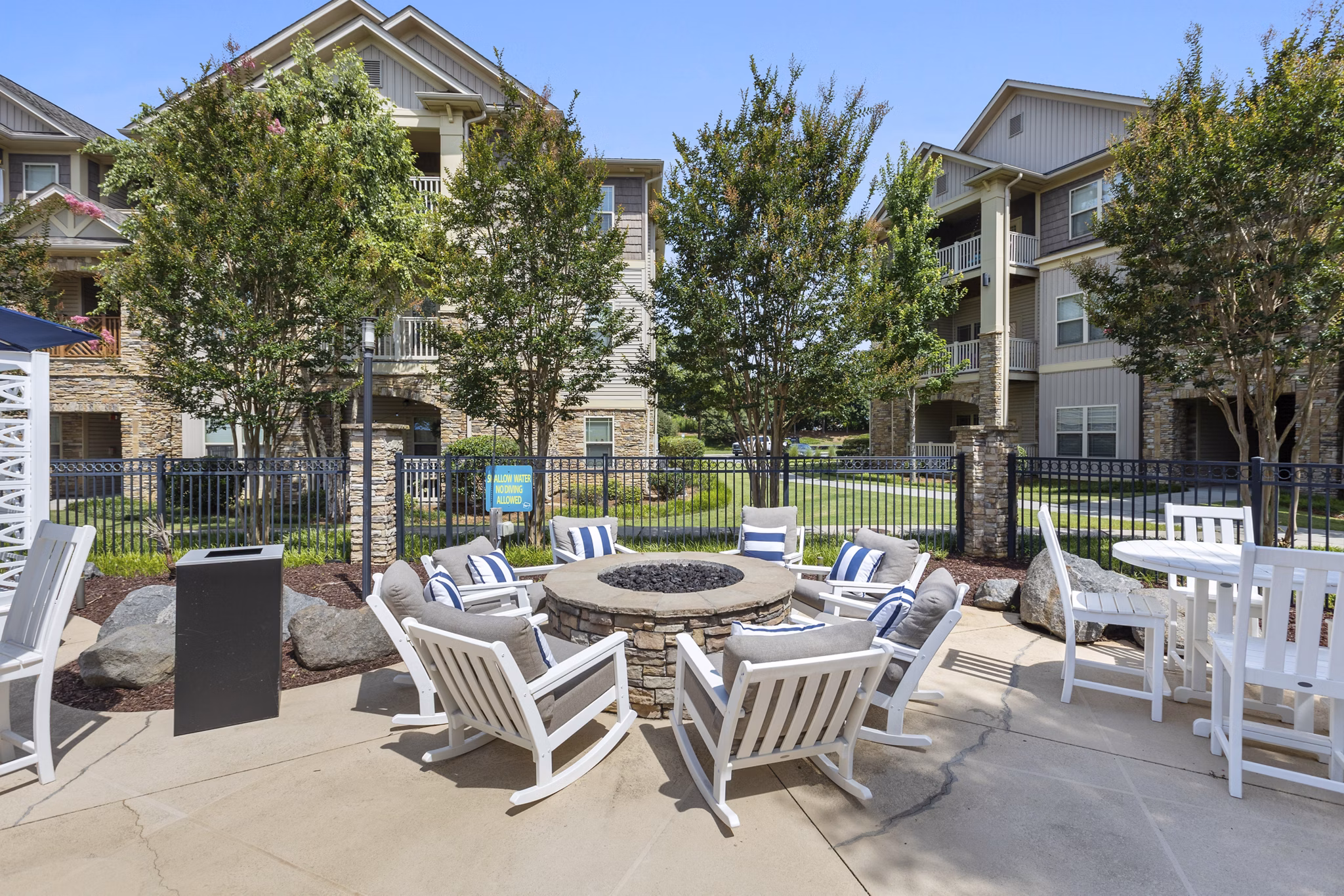 Cozy fire pit area at The Banks at Rivergate Apartments offering warm ambiance and relaxation in luxury setting