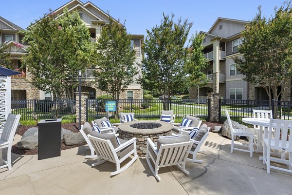 Cozy fire pit area at The Banks at Rivergate Apartments offering warm ambiance and relaxation in luxury setting