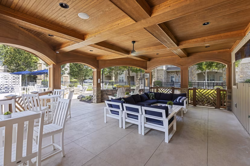 Chic patio area with modern furniture at The Banks at Rivergate Apartments