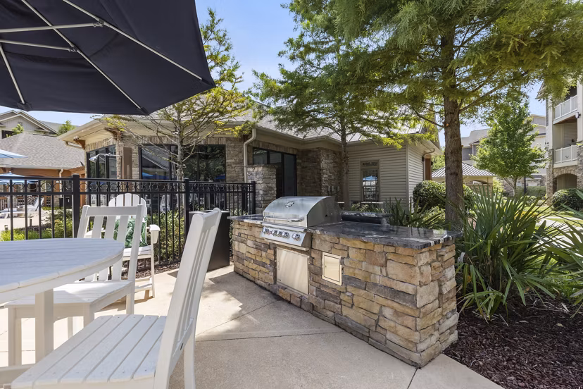Grill area with modern seating at The Banks at Rivergate Apartments, perfect for outdoor gatherings and relaxation