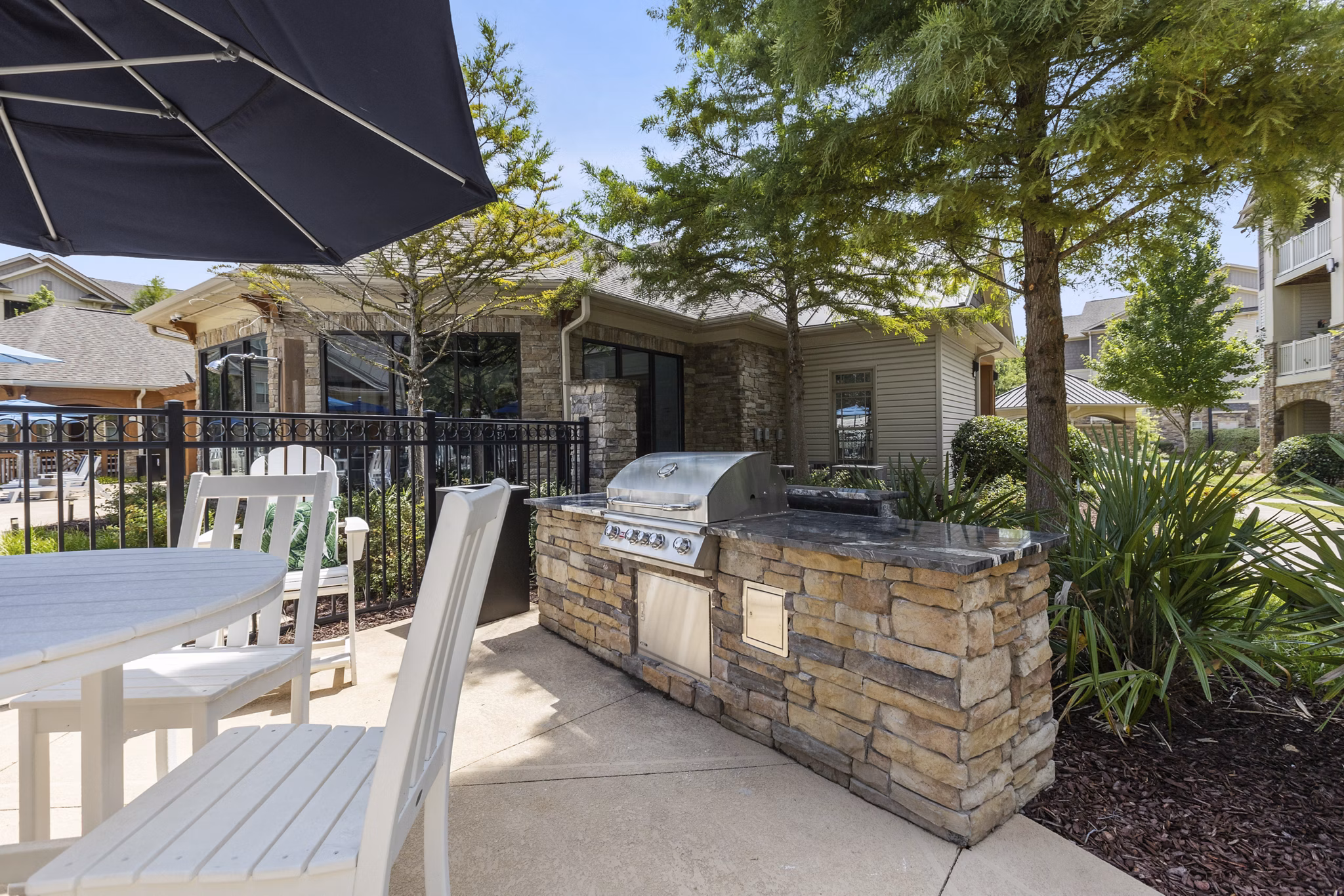 Grill area with modern seating at The Banks at Rivergate Apartments, perfect for outdoor gatherings and relaxation