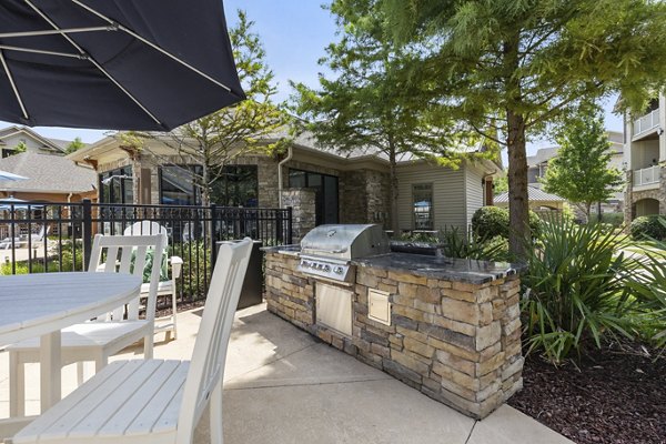 Grill area with modern seating at The Banks at Rivergate Apartments, perfect for outdoor gatherings and relaxation