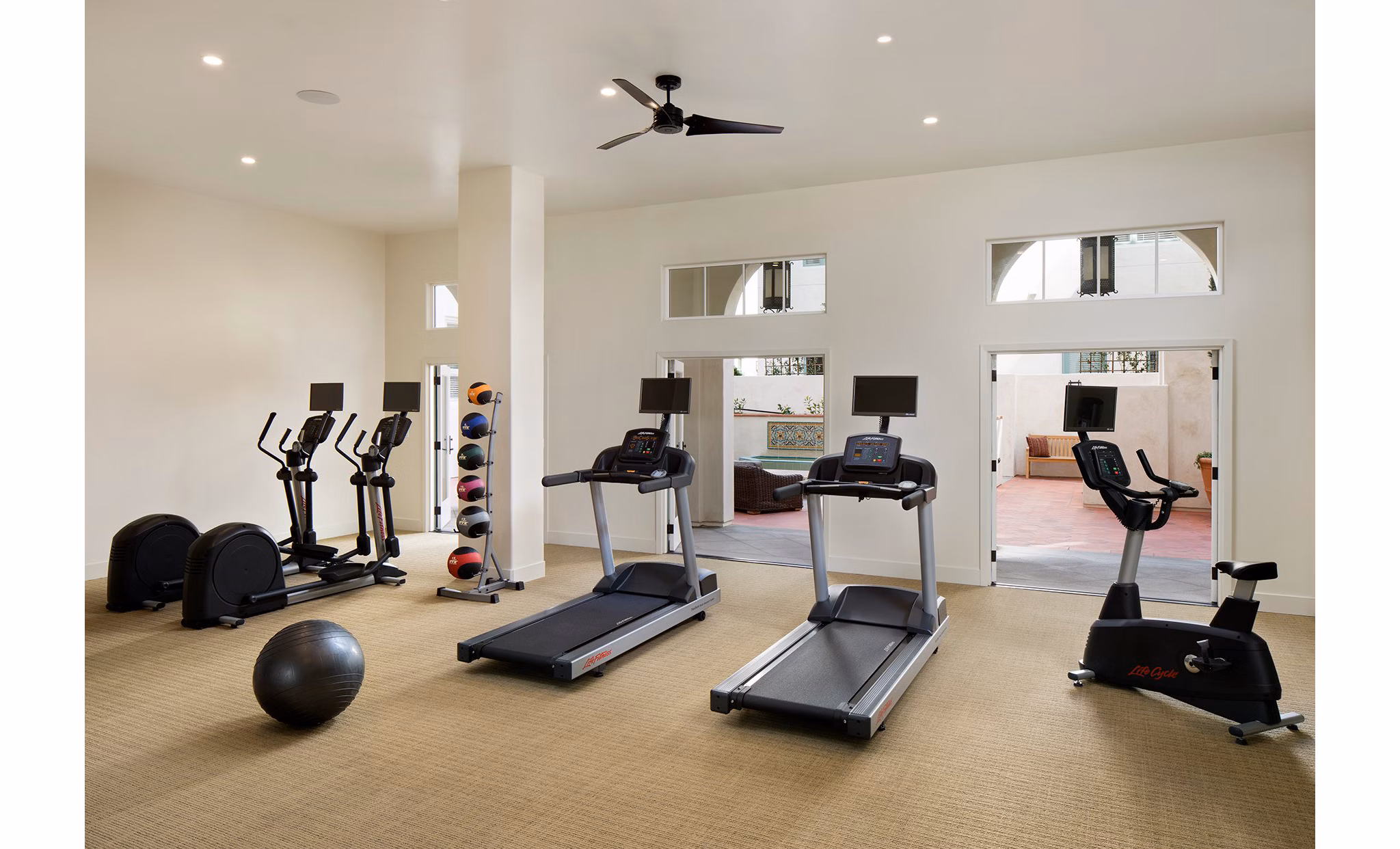 State-of-the-art fitness center with modern equipment at Andalucia Apartments