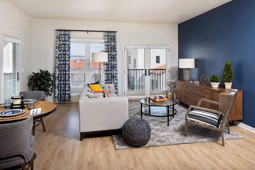 Living room with contemporary design and plush seating at Andalucia Apartments, luxury Greystar property