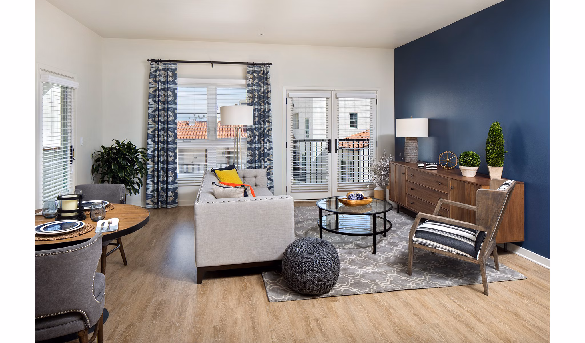 Living room with contemporary design and plush seating at Andalucia Apartments, luxury Greystar property