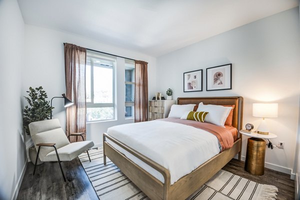 Cozy bedroom with modern decor at Esperanza at Duarte Station Apartments