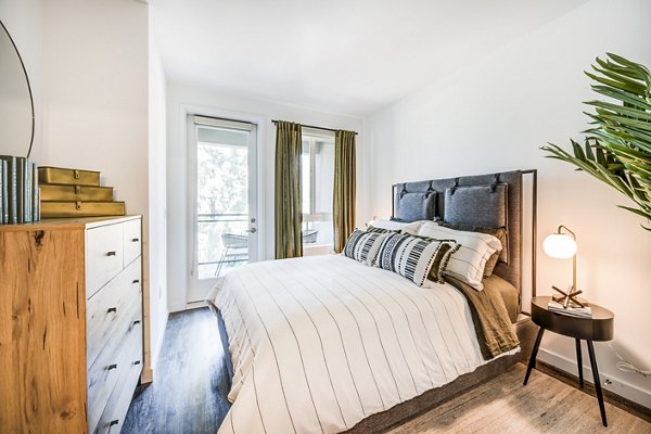 Esperanza at Duarte Station: Cozy bedroom with modern furnishings and ample natural light
