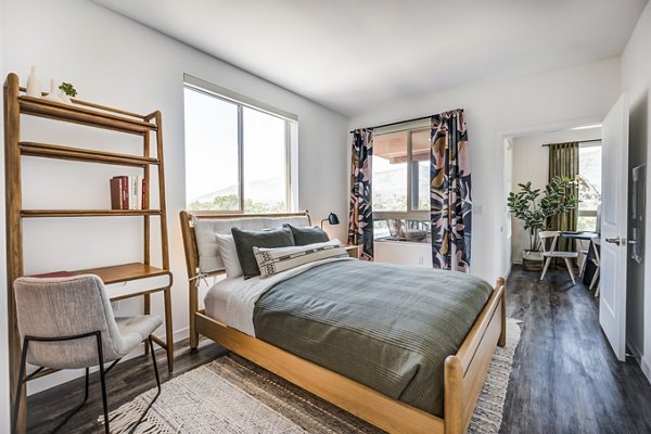 Cozy bedroom with soft lighting and modern decor at Esperanza at Duarte Station Apartments