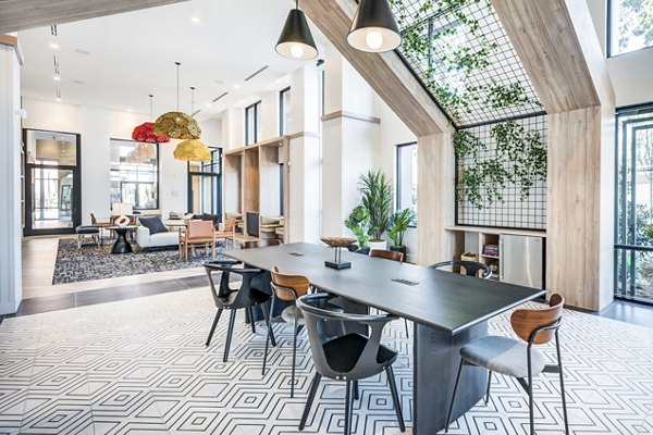 Clubhouse featuring a spacious seating area and modern decor at Esperanza at Duarte Station Apartments