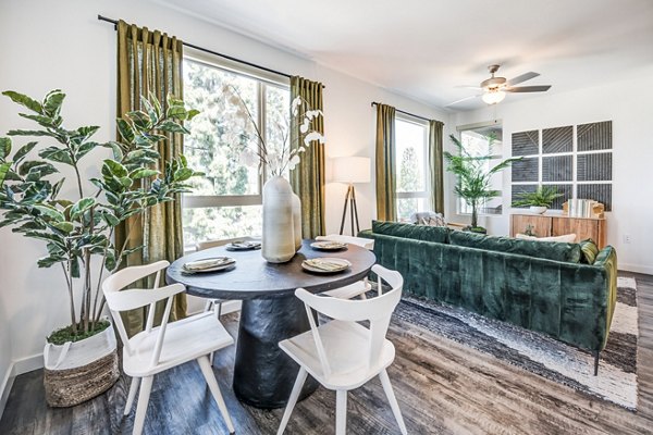 Dining room featuring elegant seating and modern lighting at Esperanza at Duarte Station Apartments