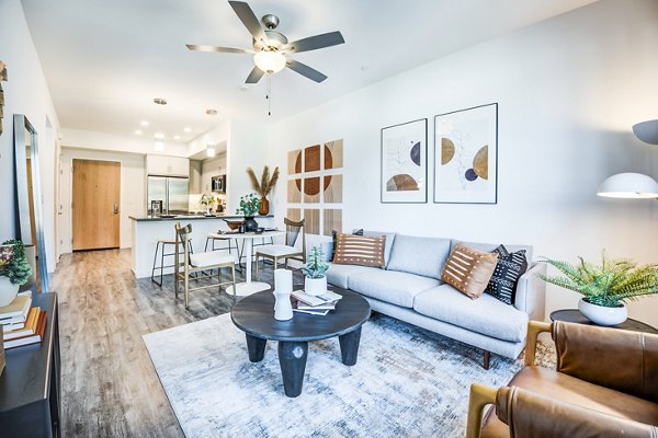 Spacious living room with modern decor at Esperanza at Duarte Station Apartments