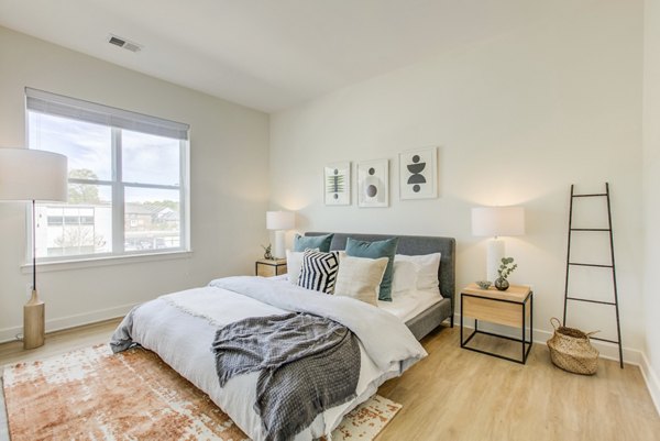 Bedroom featuring modern design and ample natural light at Centro Arlington Apartments