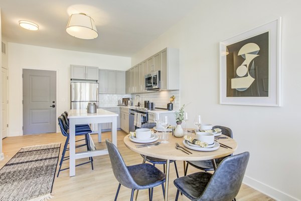 Dining area with modern furnishings and ambient lighting at Centro Arlington Apartments