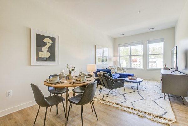 Dining area with modern decor and elegant lighting at Centro Arlington Apartments