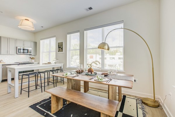 Dining area featuring modern decor and stylish lighting at Centro Arlington Apartments