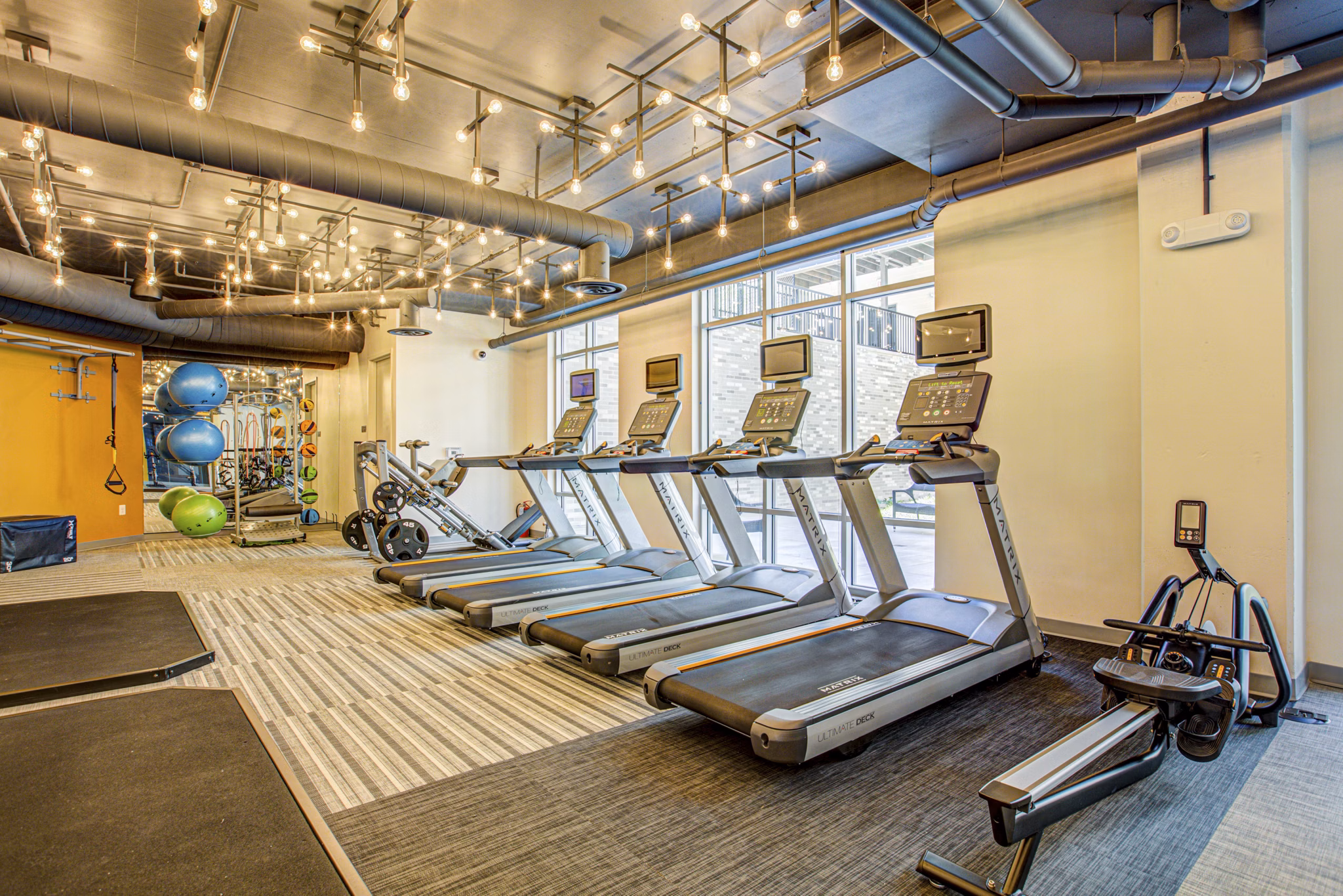 State-of-the-art fitness center with modern equipment at Centro Arlington Apartments