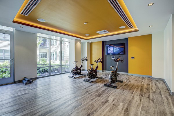 Modern yoga/spin studio with full amenities at Centro Arlington Apartments, promoting fitness and wellness for residents