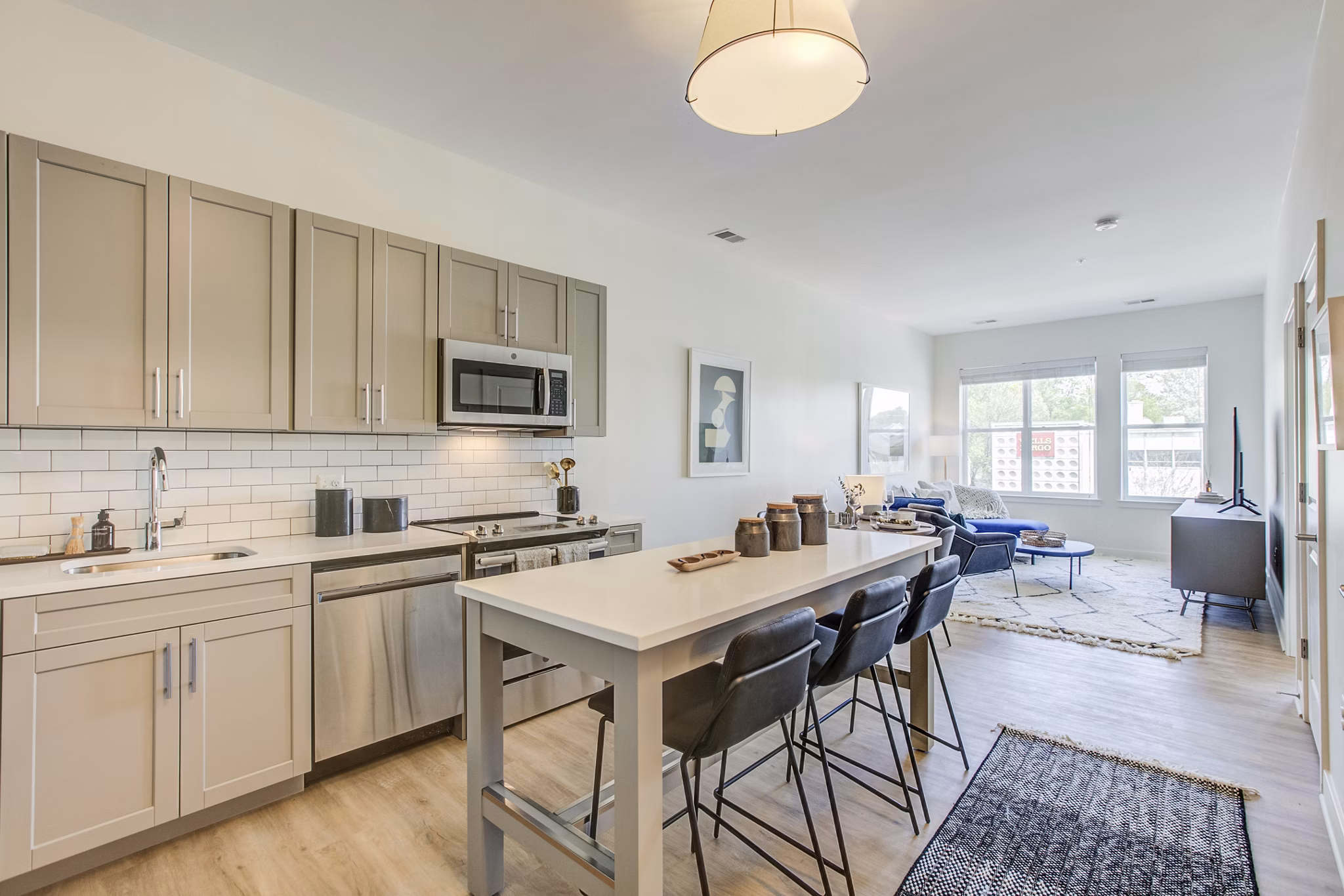 Modern kitchen with stainless steel appliances at Centro Arlington Apartments, offering a luxurious living experience in a prime location