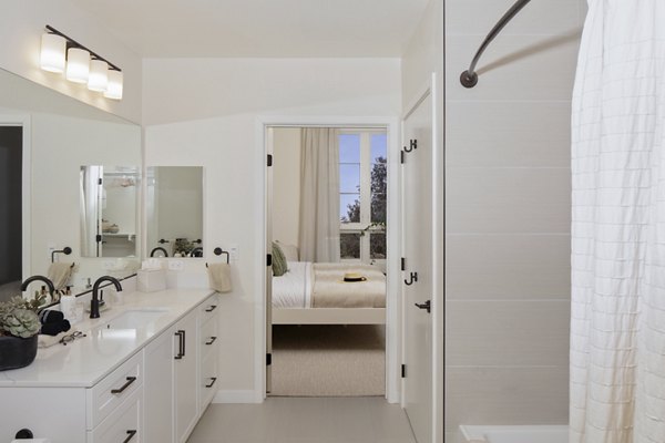 Elegant bathroom with marble countertops and modern fixtures at Everleigh San Clemente Apartments