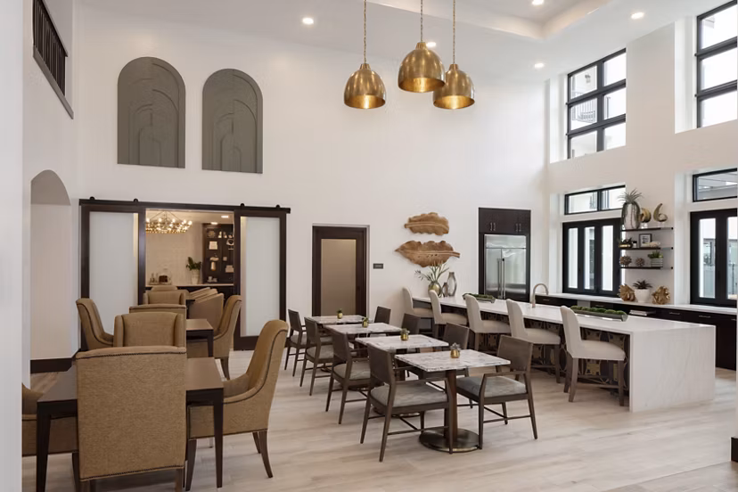 Clubhouse with modern decor and cozy seating at Everleigh San Clemente Apartments