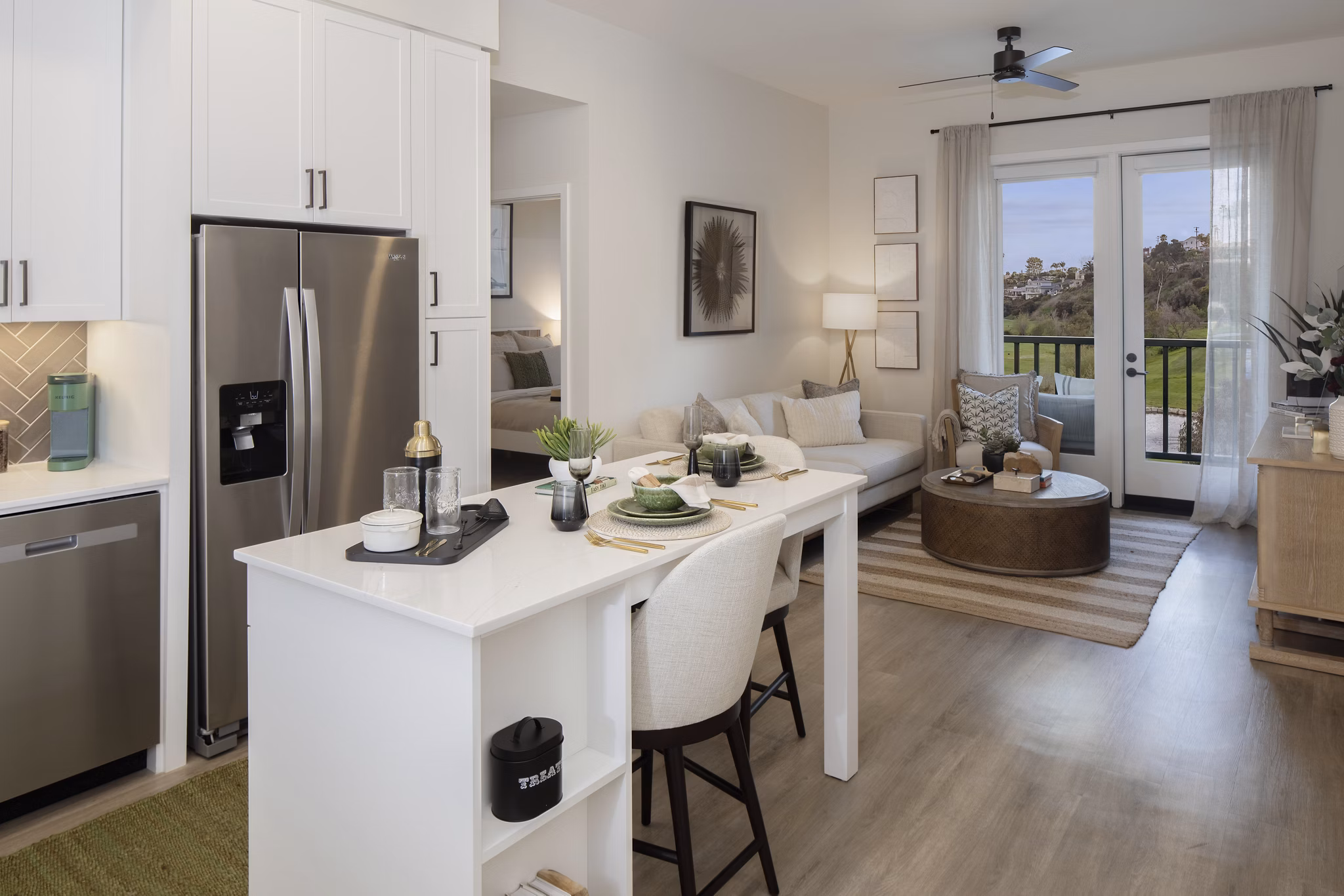 Contemporary kitchen with stainless steel appliances at Everleigh San Clemente Apartments