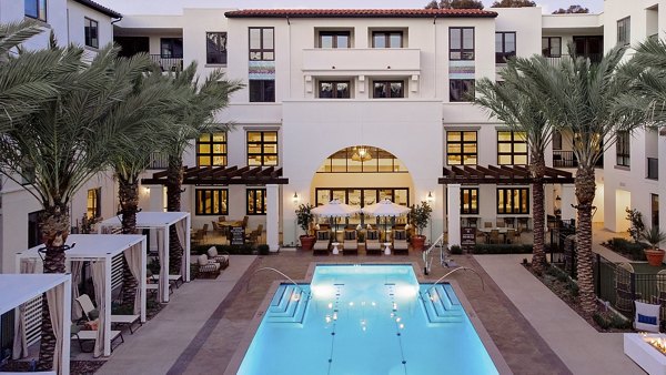 Luxury pool with resort-style cabanas at Everleigh San Clemente Apartments