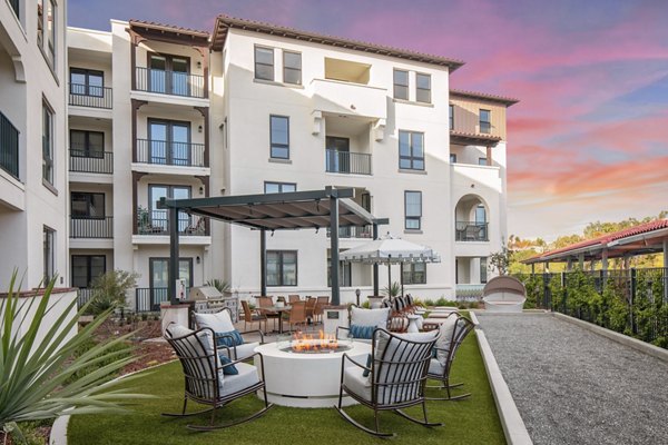 Courtyard with lush landscaping at Everleigh San Clemente luxury apartments, a Greystar community in a serene setting