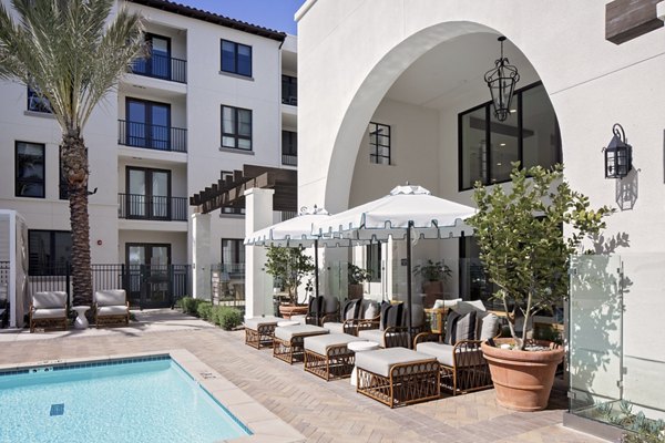 Everleigh San Clemente: Lush courtyard with seating and landscaping at luxury apartments