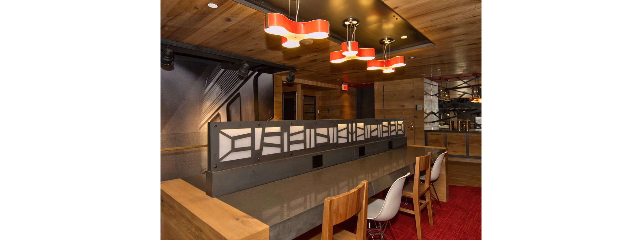 Clubhouse business center featuring modern workstations at Notch8 Apartments in downtown Denver