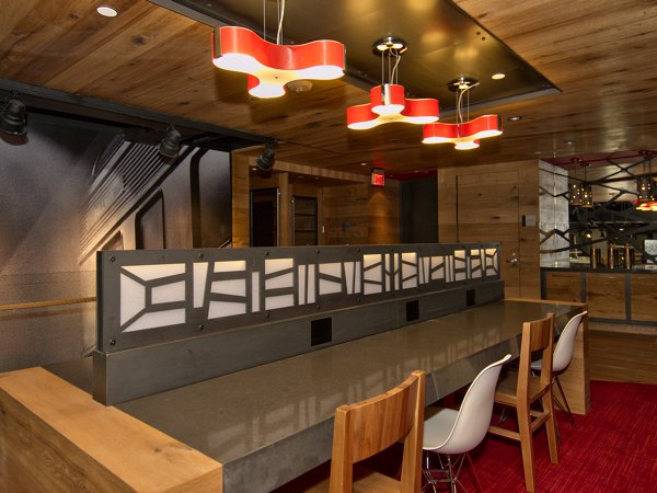 Clubhouse business center featuring modern workstations at Notch8 Apartments in downtown Denver