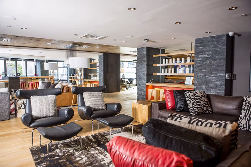 Clubhouse featuring modern design and comfortable seating at Notch8 Apartments luxury community