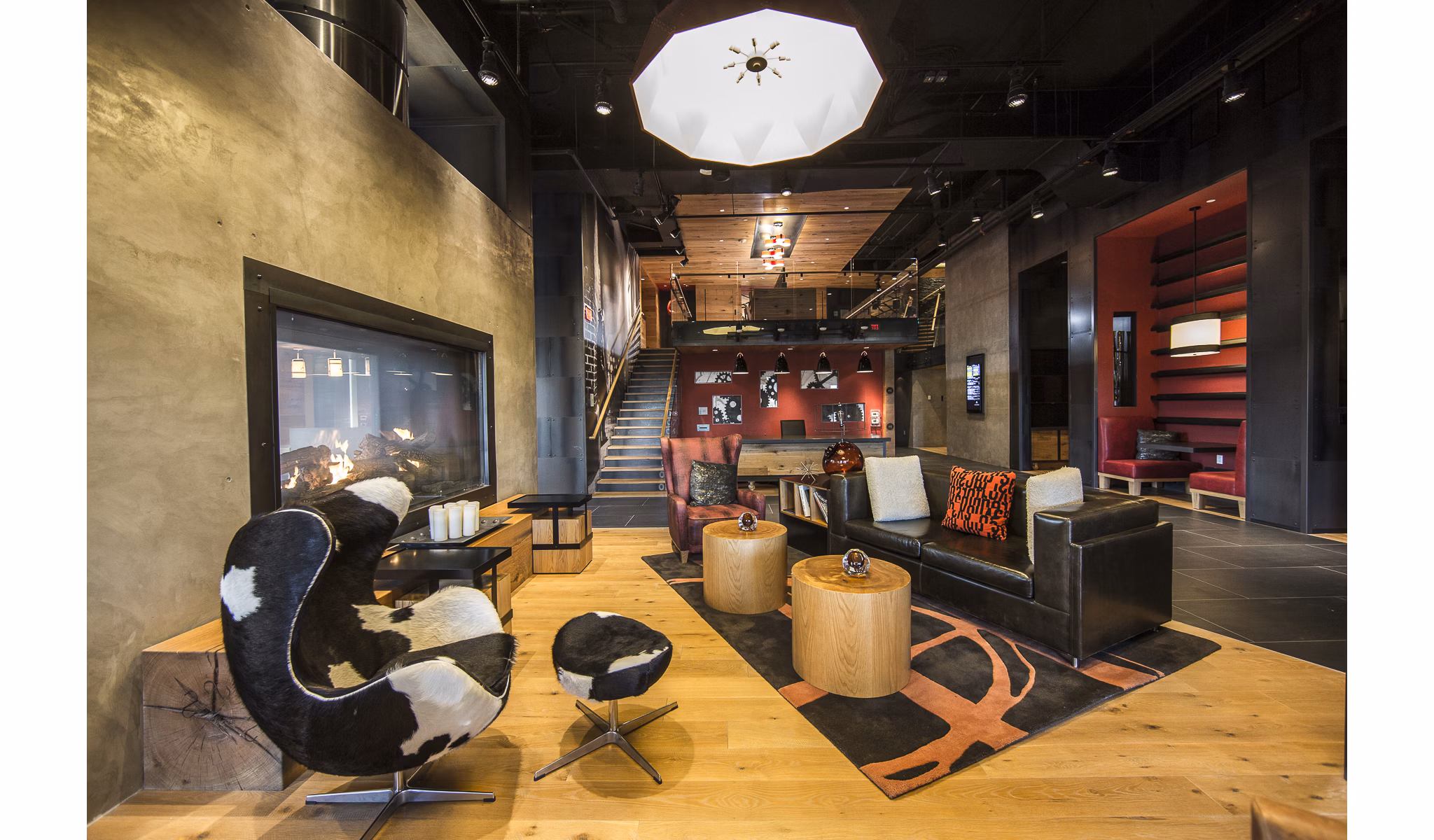 Luxury clubhouse with modern seating areas at Notch8 Apartments, perfect for socializing and events, showcasing upscale amenities for residents