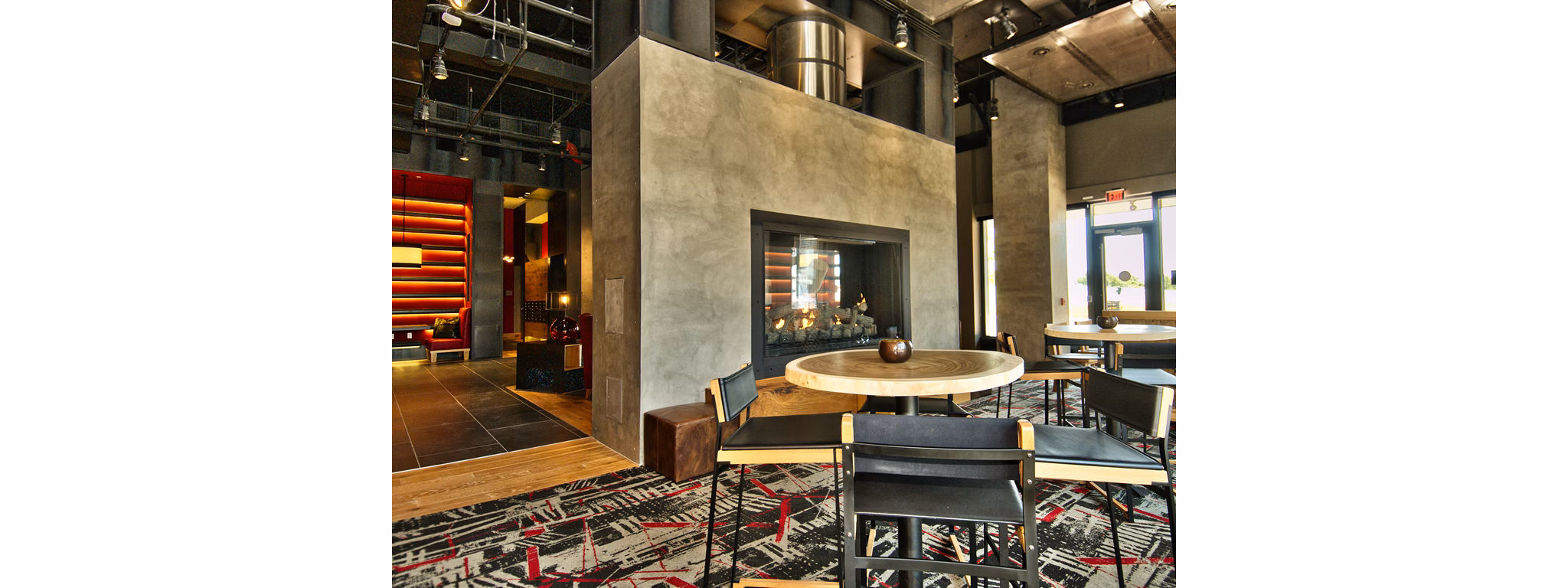 Clubhouse featuring an open lounge area and modern design at Notch8 Apartments, a luxury living community in the heart of the city
