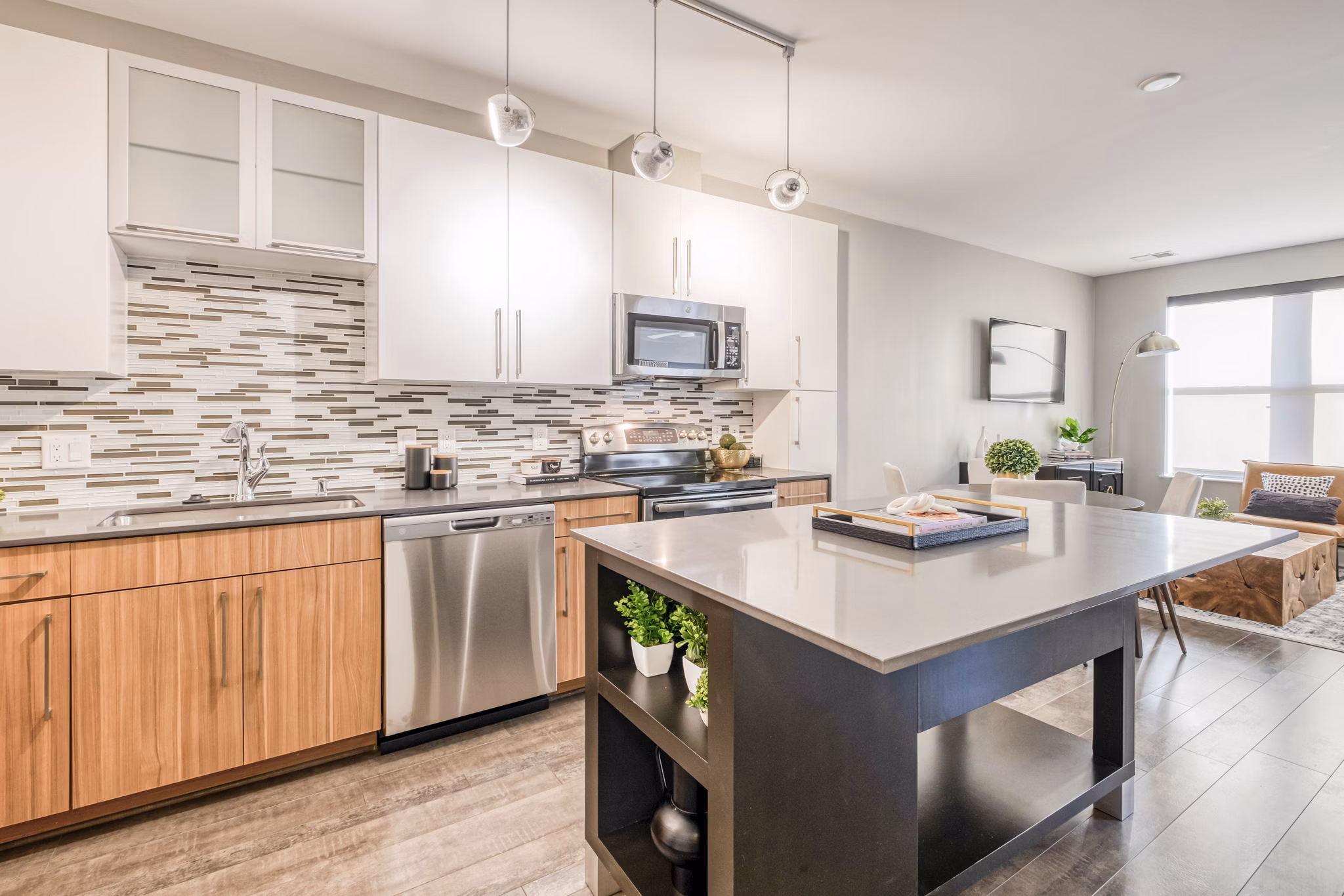 Modern kitchen with stainless steel appliances at Notch8 Apartments