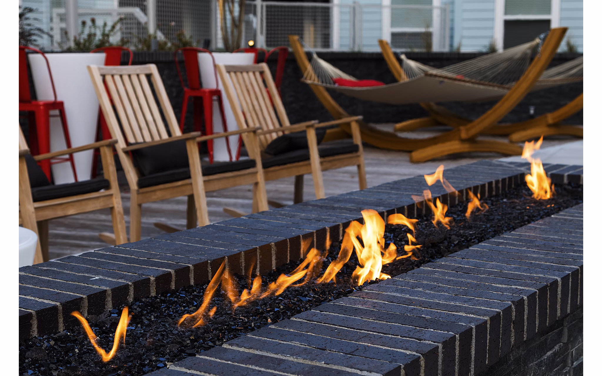 Cozy outdoor fire pit at Notch8 Apartments, ideal for relaxing and socializing in luxury surroundings