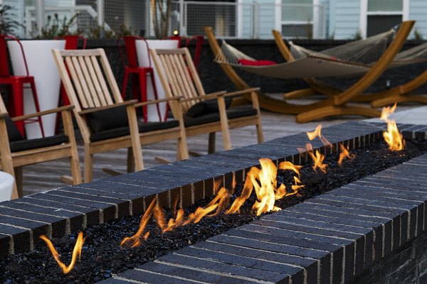 Cozy outdoor fire pit at Notch8 Apartments, ideal for relaxing and socializing in luxury surroundings