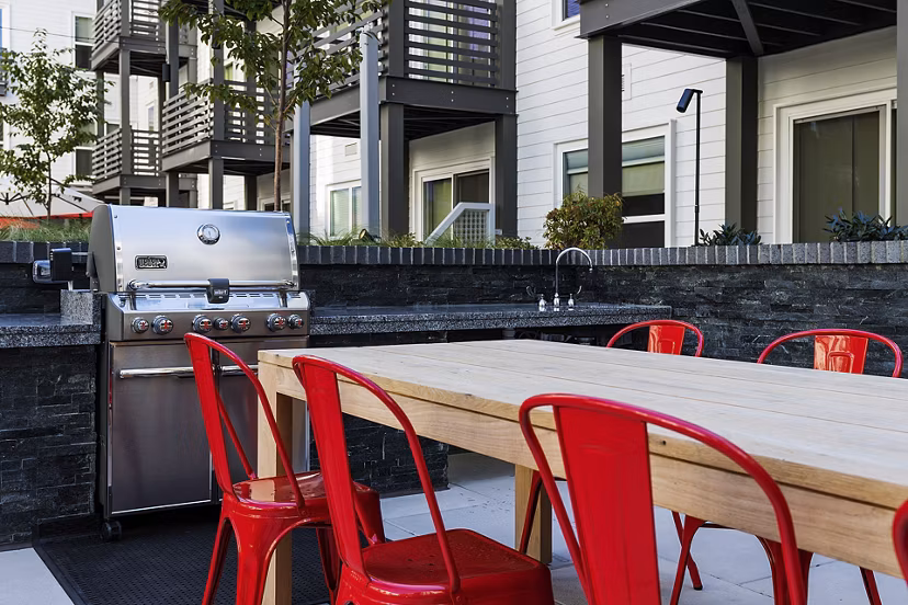 Grill area with modern seating at Notch8 Apartments in San Jose