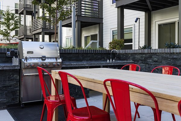 Grill area with modern seating at Notch8 Apartments in San Jose