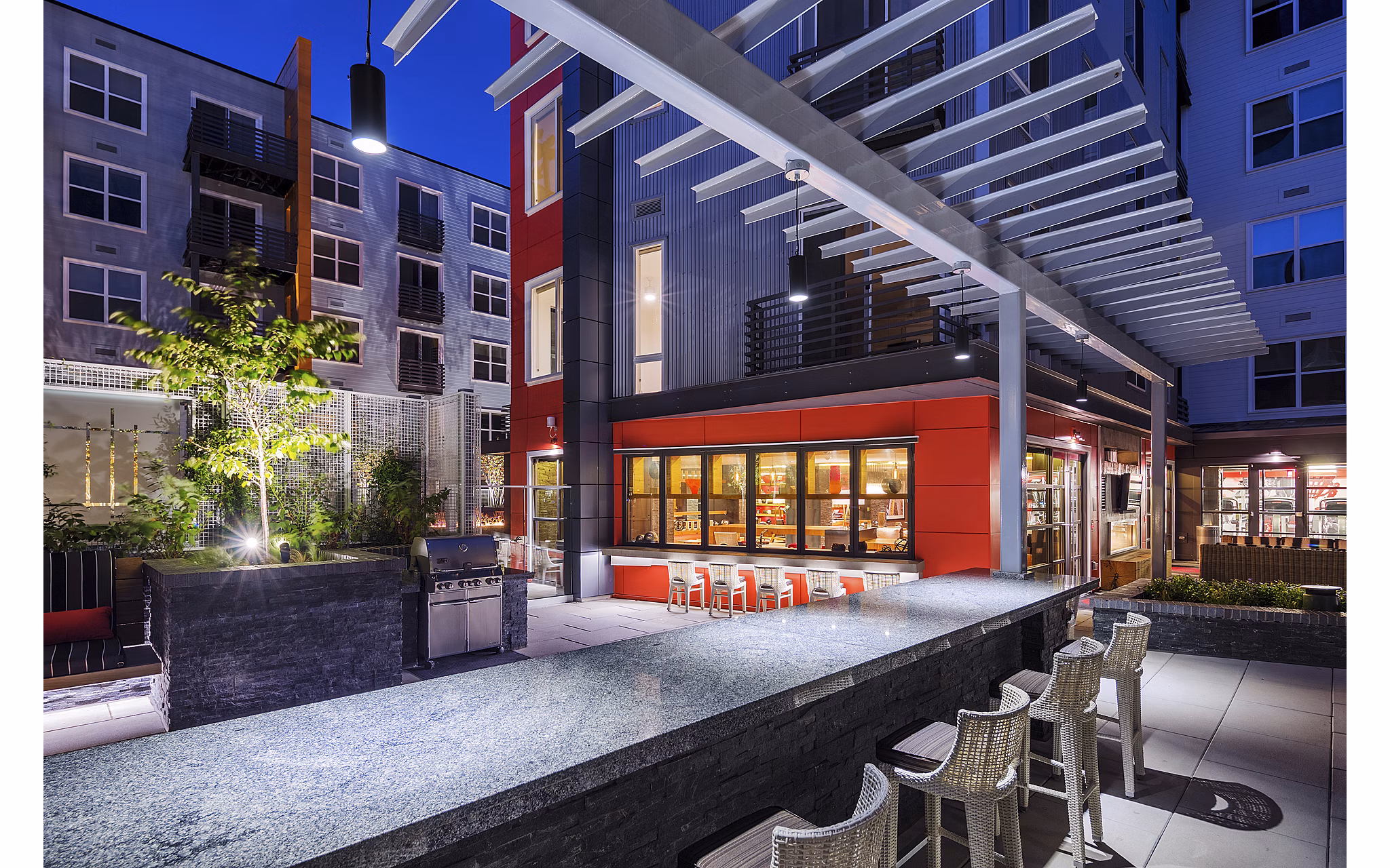 Outdoor grilling area with modern design at Notch8 Apartments, a luxury Greystar property
