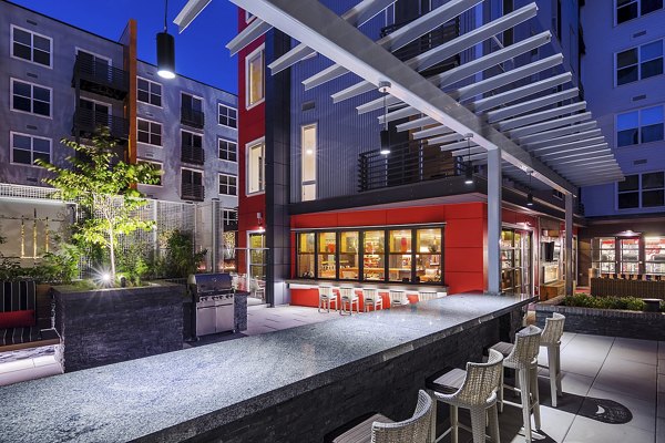 Outdoor grilling area with modern design at Notch8 Apartments, a luxury Greystar property