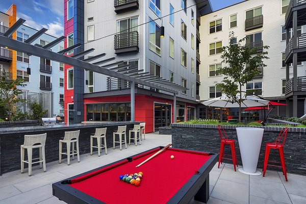 Courtyard featuring landscaped gardens and seating areas at Notch8 Apartments, a luxury Greystar property