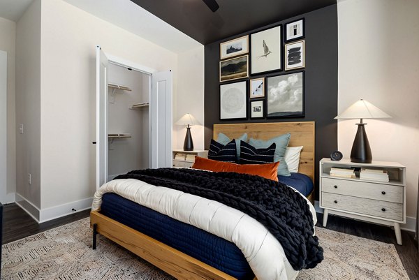 Cozy bedroom with modern decor and ample natural light at The Signal Apartments