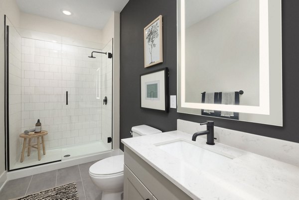 Luxurious bathroom featuring modern fixtures at The Signal Apartments, designed for comfort and style in city living