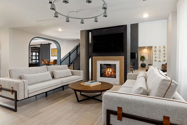 Stylish clubhouse with modern decor at The Signal Apartments, offering a relaxing space for residents in this luxury community