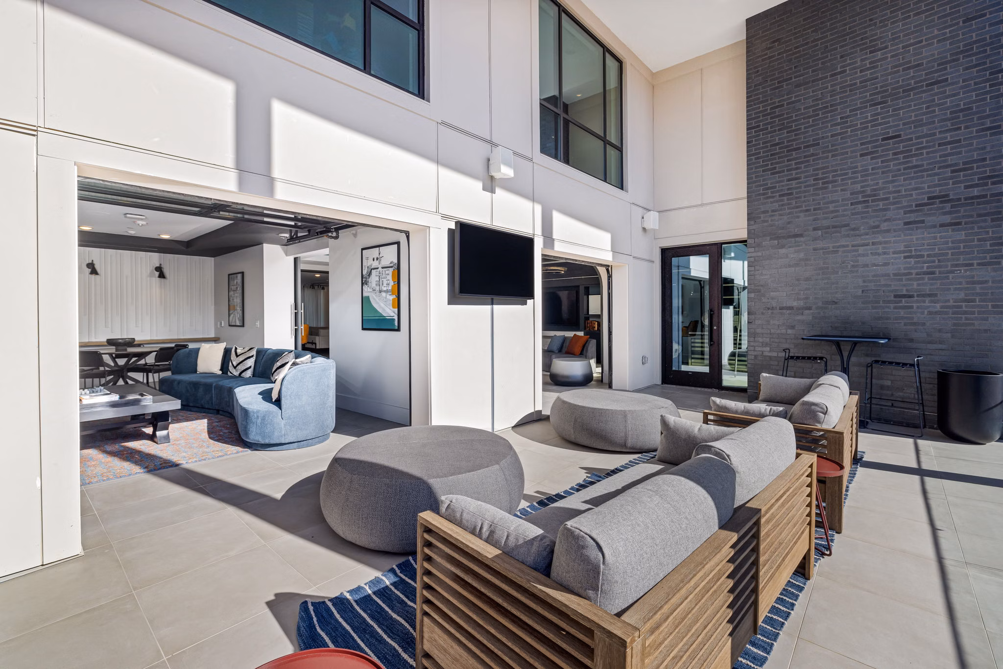 Clubhouse featuring modern design and ample seating at The Signal Apartments