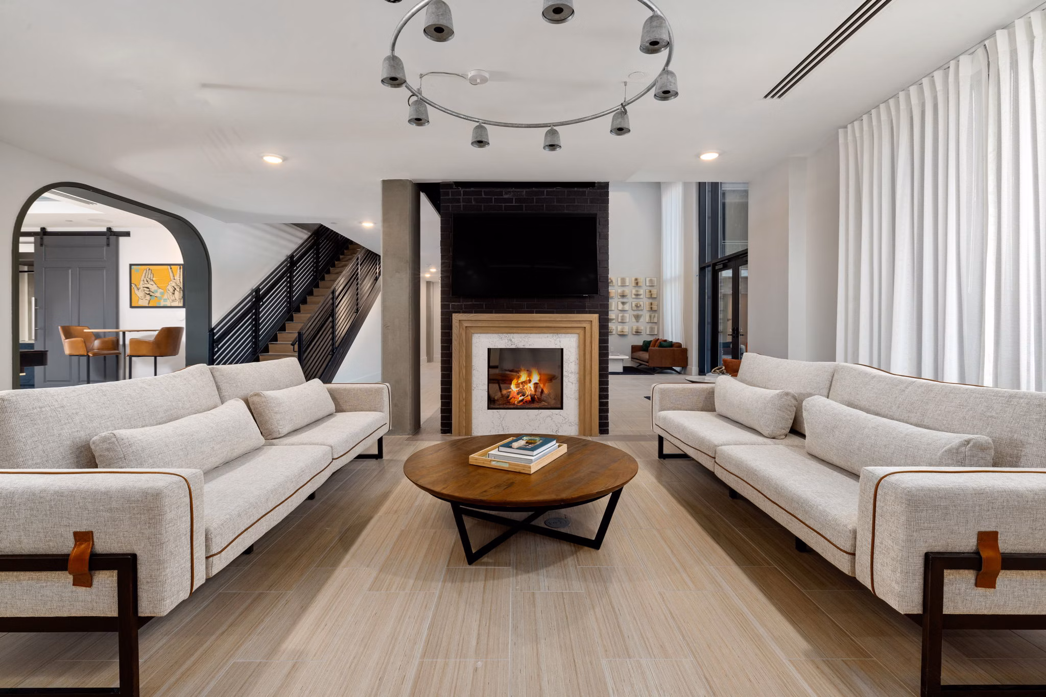 Clubhouse lounge featuring modern decor and ample seating at The Signal Apartments
