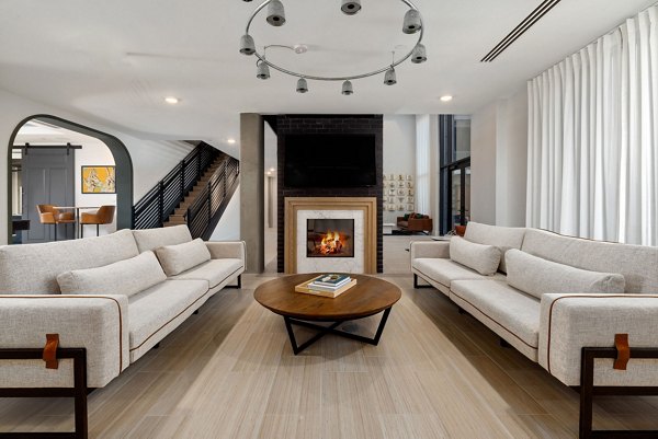 Clubhouse lounge featuring modern decor and ample seating at The Signal Apartments