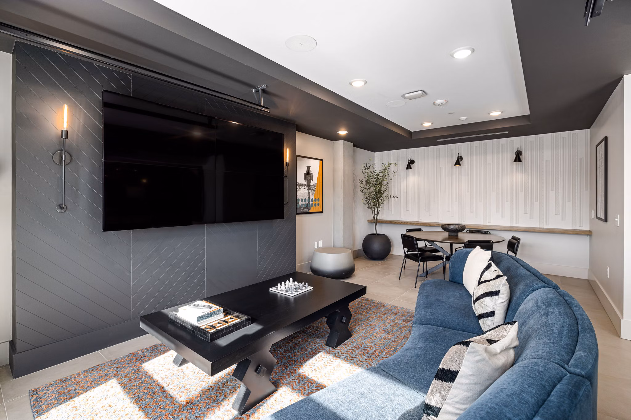 Clubhouse with modern design and seating areas at The Signal Apartments