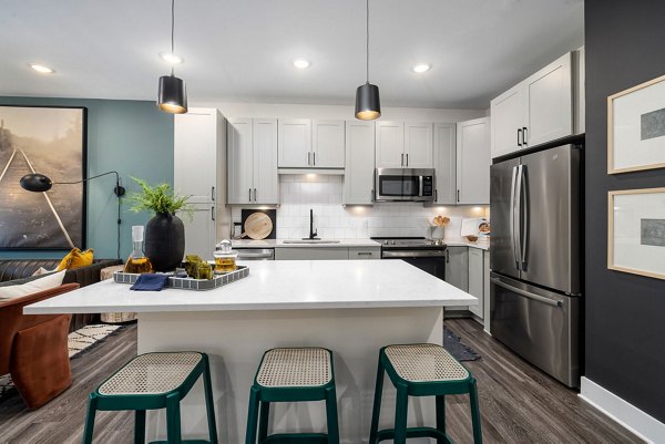 Modern kitchen with stainless steel appliances at The Signal Apartments