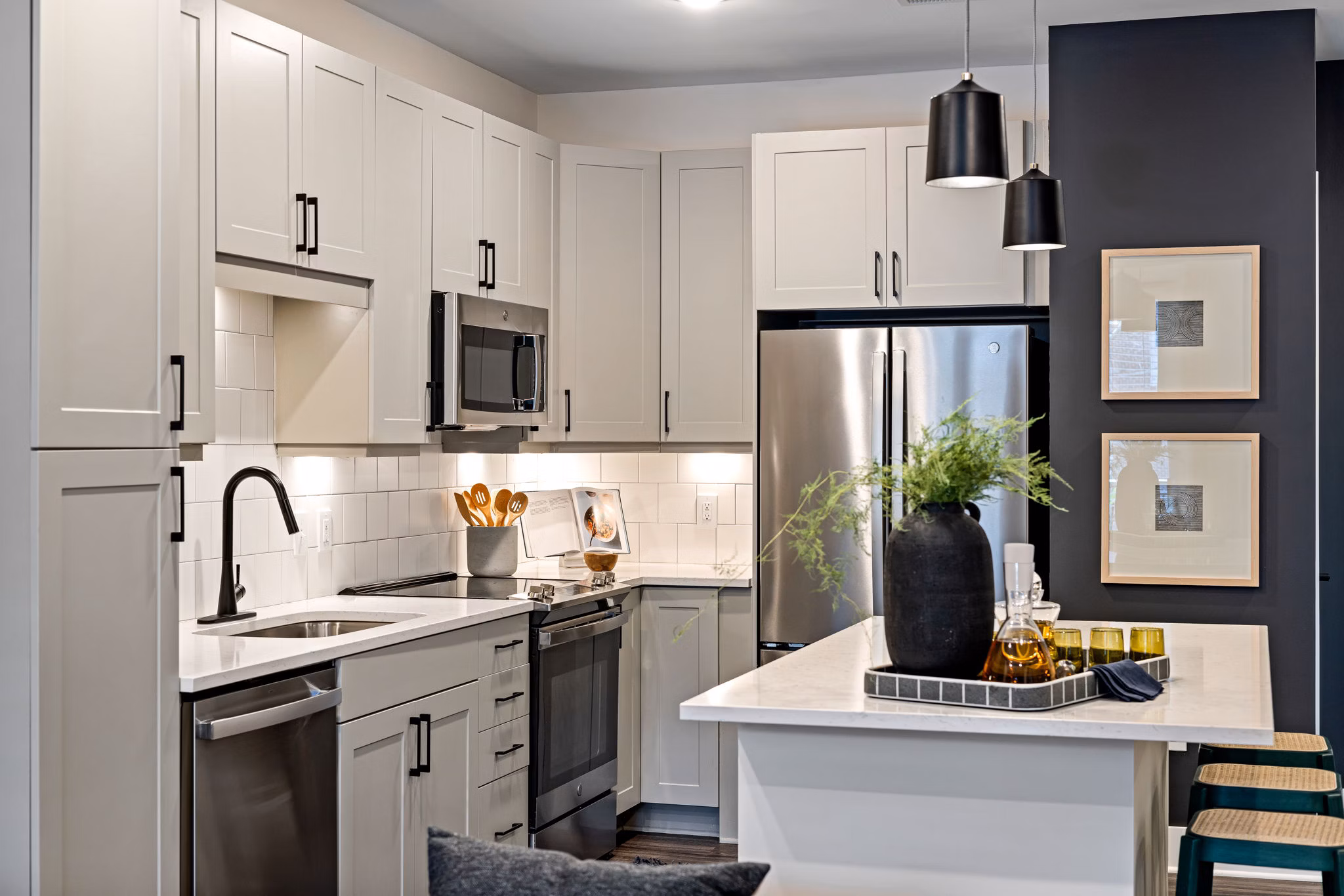 Modern kitchen with stainless steel appliances at The Signal Apartments